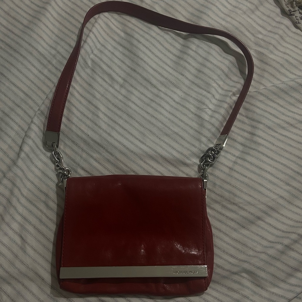 Michael Kors red shoulder purse with silver.